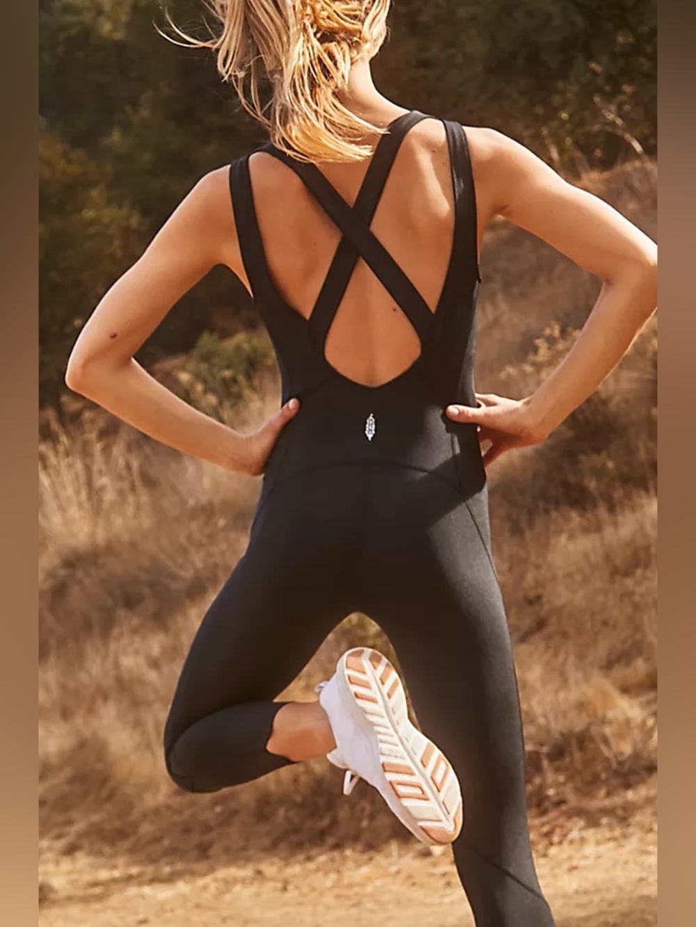 Free people movement fp Sleek Black V‑Neck jumpsuit strappy open back vuori alo
